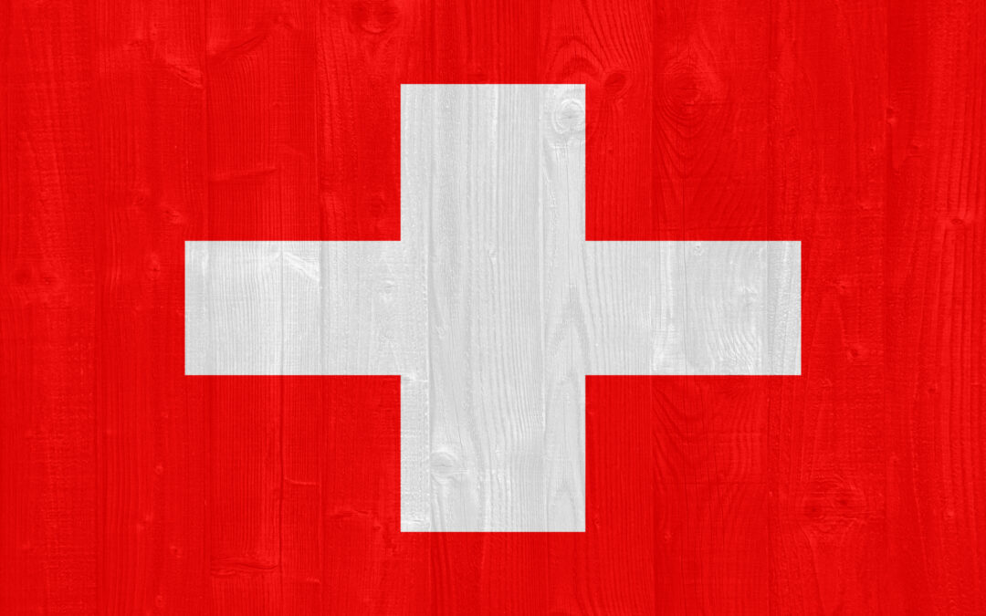 Goats grazing in green pasture