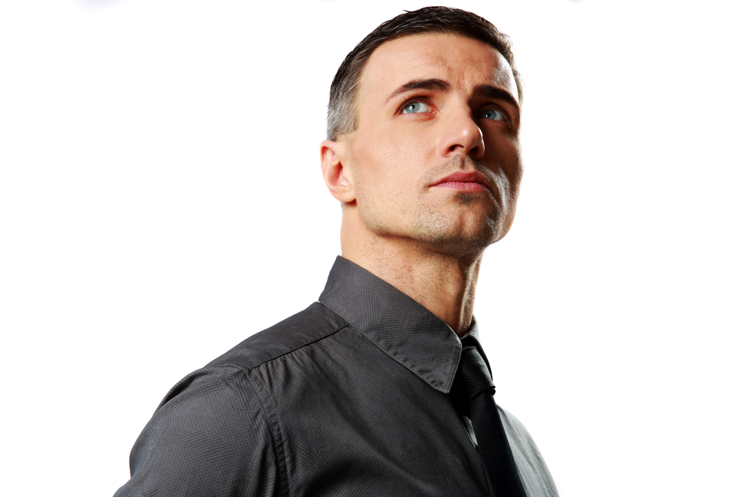 portrait of a confident businessman looking up isolated on a white background scaled